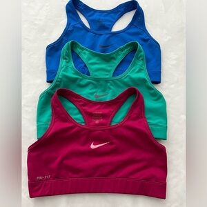 Nike Dry-Fit sports Bra a set of three blue, pink and green. Size medium